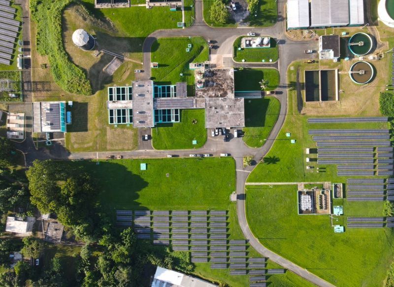 Aerial view of a PRASA water treatment plant with ground-mounted solar arrays
